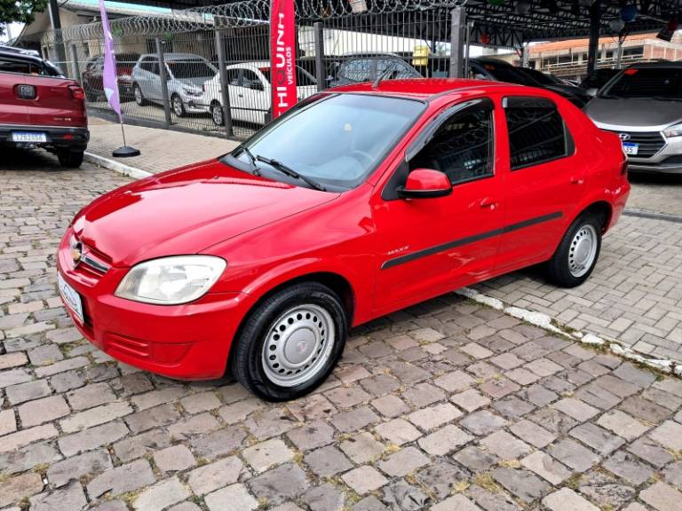 CHEVROLET - PRISMA - 2010/2011 - Vermelha - R$ 29.900,00